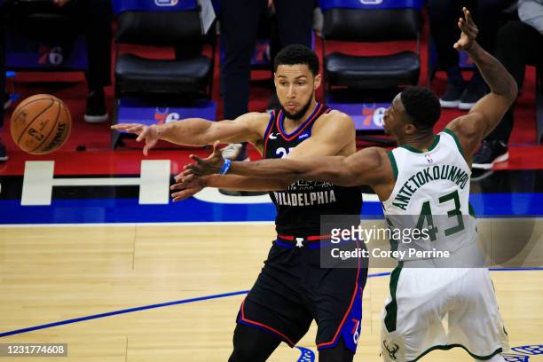 Ben Simmons of the Philadelphia 76ers passes against Thanasis Antetokounmpo of the Milwaukee Bucks during the first quarter at the Wells Fargo Center...