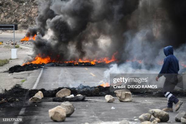 View of a blockade in the road linking the highland cities of Puno and Arequipa on March 17, 2021 following clashes with the national police during a...