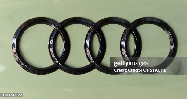 The logo of the German carmaker Audi is seen on a car on March 18, 2021 at their headquarters in Ingolstadt, southern Germany, as the company...