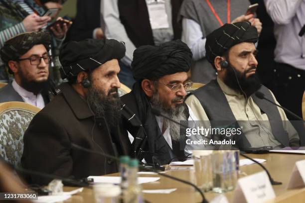 People of Taliban delegation headed by Abdul Ghani Baradar, the groups deputy leader attend a meeting on Afghan peace with the participation of...