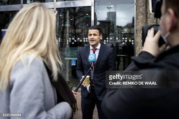 Party leader Farid Azarkan of DENK answers journalists' questions as he arrives at the Binnenhof, the venue of Netherlands' parliament, in The Hague,...