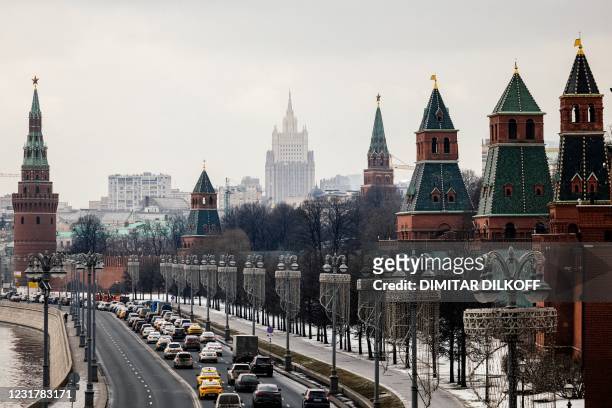 This picture taken on March 18 shows the Kremlin towers in front of the Russian Foreign Ministry headquarters. - Russian President Vladimir Putin on...