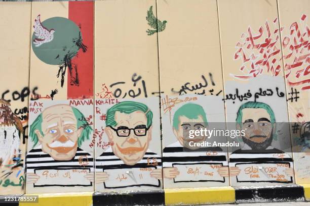 Protesters draw attention to the country's problems with graffiti drawings in Beirut, Lebanon on March 18, 2021. Protests across the country continue...