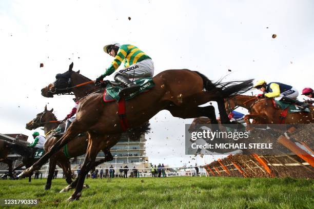 Sire Du Berlais ridden by jockey Mark Walsh clears the last fence in the the Paddy Power Stayers' Hurdle on Day Three of the Cheltenham Festival at...