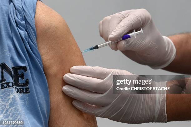 Man receives the Pfizer-BioNTech COVID-19 Vaccine at a vaccination center in Nuremberg, southern Germany, on March 18 amid the ongoing novel...