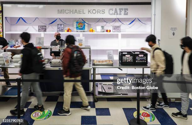 Pat Teague, executive chef of the Burlington School District, works the lunch counter at the Michael Kors Cafe, located at Burlington High School's...