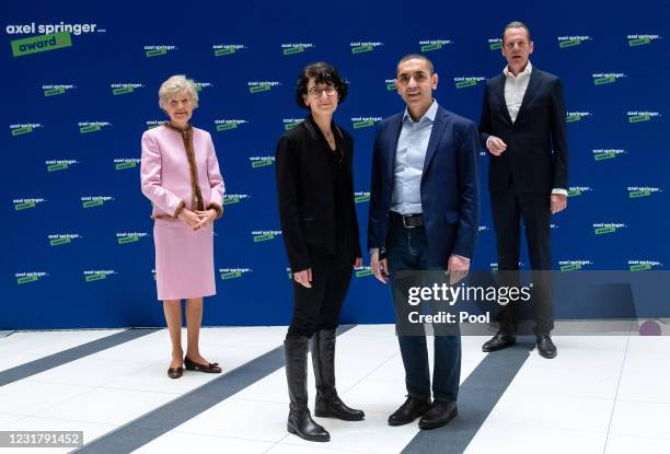 Ugur Sahin and wife Özlem Türeci , German-Turkish scientists who made BioNTechs coronavirus vaccine, are awarded by publisher Friede Springer und...