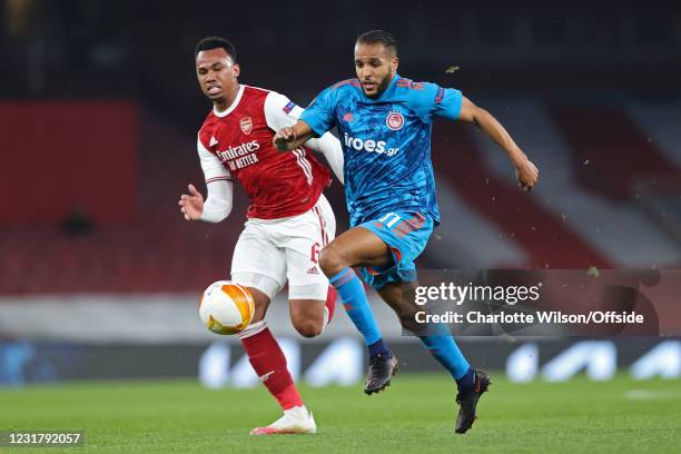 Gabriel of Arsenal battles with Youssef El Arabi of Olympiacos during the UEFA Europa League Round of 16 Second Leg match between Arsenal and...