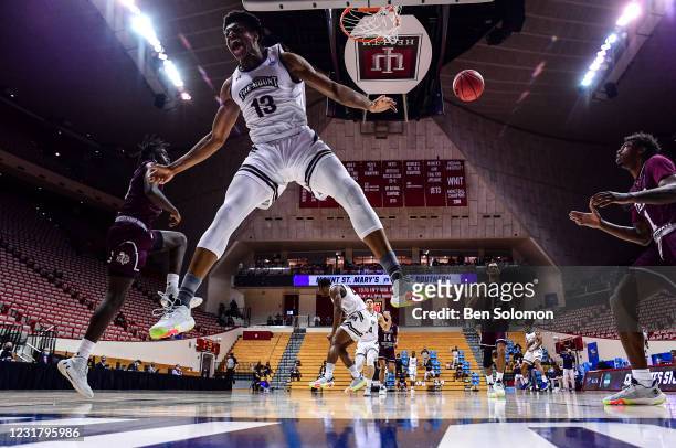 Mezie Offurum of the Mount St. Mary's Mountaineers dunks the ball against the Texas Southern Tigers in the First Four round of the 2021 NCAA Division...