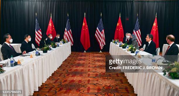 Secretary of State Antony Blinken , joined by National Security Advisor Jake Sullivan , speaks while facing Yang Jiechi , director of the Central...