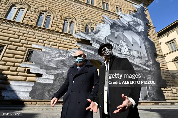 French artist JR poses with Director General of the Strozzi Foundation, Arturo Galansino, during the unveiling of JR's visual installation "La...