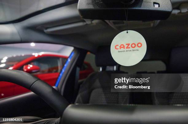 Cazoo logo on an air freshener inside an automobile at the Cazoo Ltd. Customer centre in Southampton, U.K., on Thursday, March 18, 2021. Cazoo Ltd.,...