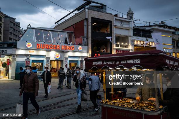 Chestnut street vendor across the street from a Burger King Corp. Restaurant, operated by TFI TAB Food Investments, in Istanbul, Turkey, on Tuesday,...
