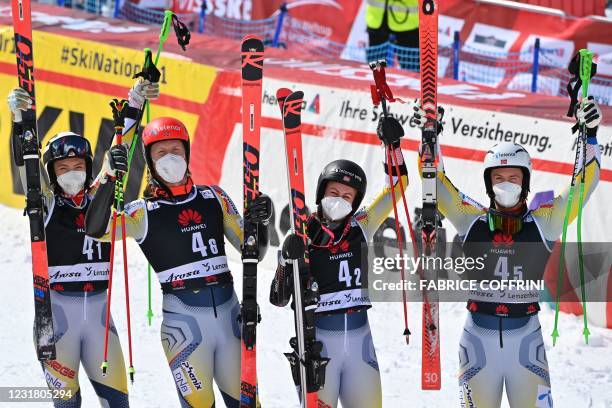 Norway's Kristin Lysdahl, Norway's Leif Kristian Nestvold-Haugen, Norway's Kristina Riis-Johannessen and Norway's Sebastian Foss-Solevaag celebrate...