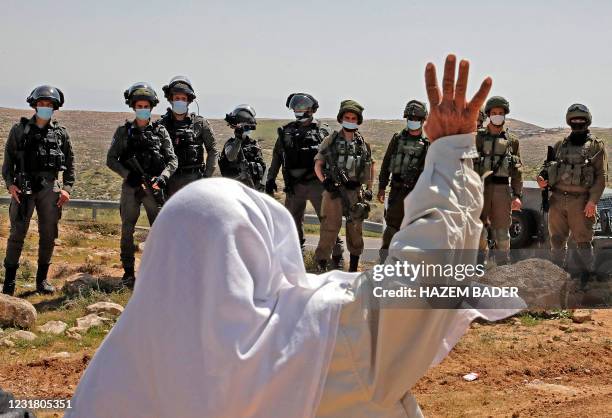 An elderly Palestinian man reacts during a rally protesting the confiscation of land for the Israeli settlement of Karmel, near Yatta village south...