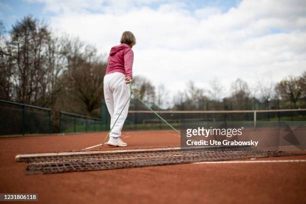 Dortmund, Germany In this photo illustration a 82 years old woman is playing tennis on March 17, 2021 in Dortmund, Germany.