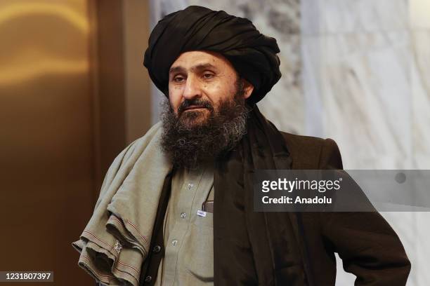 Taliban delegation headed by Abdul Ghani Baradar, the groups deputy leader, are seen leaving the hotel after attending the meeting on Afghan peace...