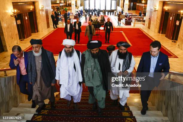 Taliban delegation headed by Abdul Ghani Baradar and Sher Mohammad Abbas Stanikzai are seen leaving the hotel after attending the meeting on Afghan...