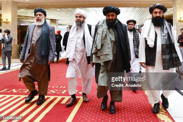 Taliban delegation headed by Abdul Ghani Baradar and Sher Mohammad Abbas Stanikzai are seen leaving the hotel after attending the meeting on Afghan...