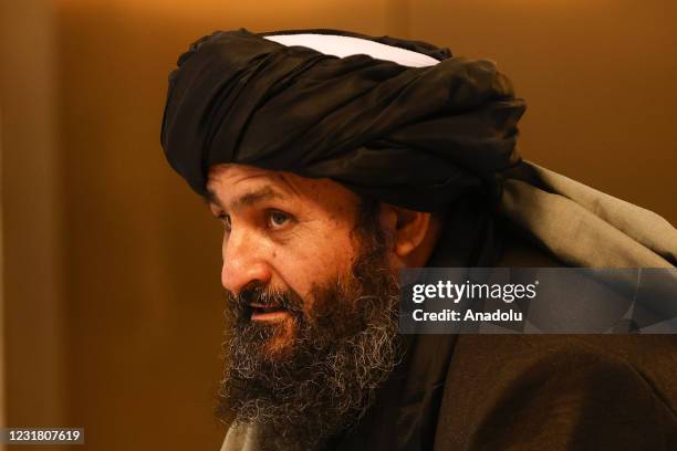 Taliban delegation headed by Abdul Ghani Baradar, the groups deputy leader, are seen leaving the hotel after attending the meeting on Afghan peace...