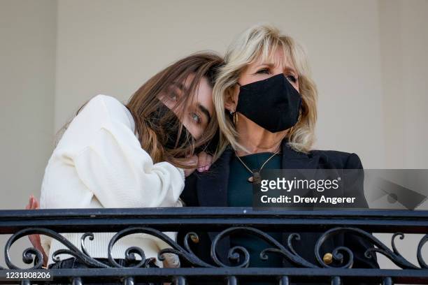 Granddaughter Natalie Biden and First Lady Dr. Jill Biden watch from the Truman Balcony as U.S. President Joe Biden boards Marine One on the South...