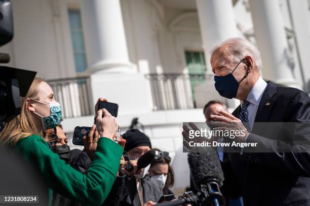 President Joe Biden talks briefly with reporters before boarding Marine One on the South Lawn of the White House on March 19, 2021 in Washington, DC....
