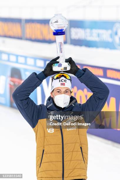 Sturla Holm Laegreid of Norway with the globe of the individual score during the Men 10 km Sprint Competition at the IBU World Championships Biathlon...