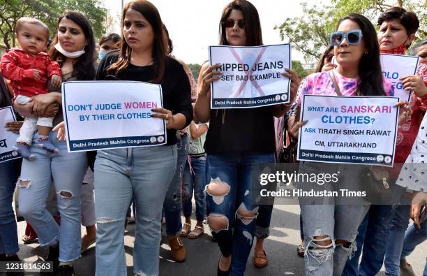 Women cell protest against Uttarakhand chief minister Tirath Singh Rawat made a comment questioning the character of those who wear such jeans, at...