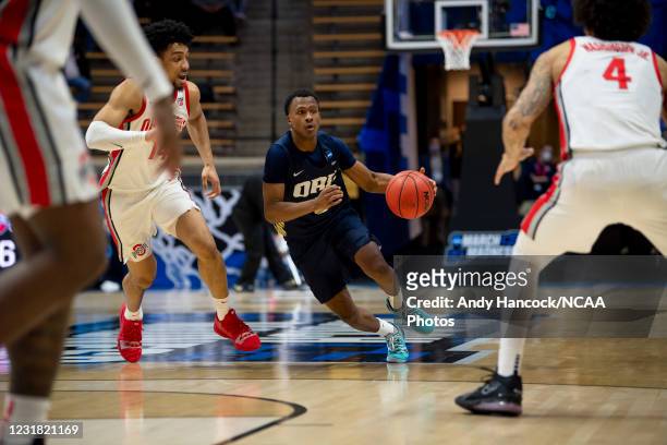 Max Abmas of Oral Roberts University dribbles past Justice Sueing of Ohio State in the first round of the 2021 NCAA Division I Mens Basketball...