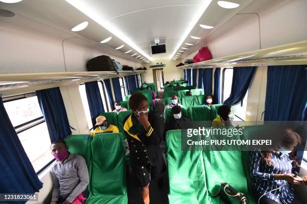 Train hostess attends to passengers aboard the new standard gauge shuttling between the economic hub of Lagos and Ibadan, the regional capital of...