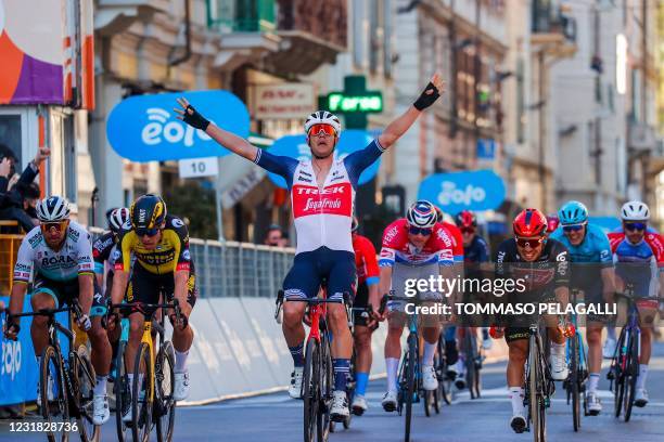 Team Trek rider Belgium's Jasper Stuyven celebrates as he crosses the finish line to win the one-day classic cycling race Milan-San Remo on March 20,...