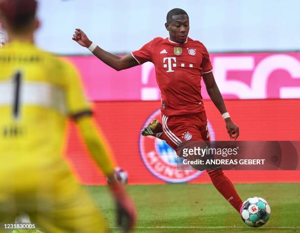 Bayern Munich's Austrian defender David Alaba attempts to score during the German first division Bundesliga football match between FC Bayern Munich...