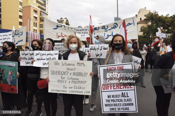 Lebanese women gather at Bishara El Huri street during a demonstration to protest against the living conditions brought about by the economic crisis...