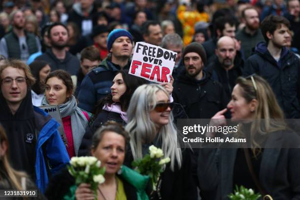 Protesters march during a "World Wide Rally For Freedom" protest on March 20, 2021 in London, England. "World Wide Rally For Freedom" protests, with...