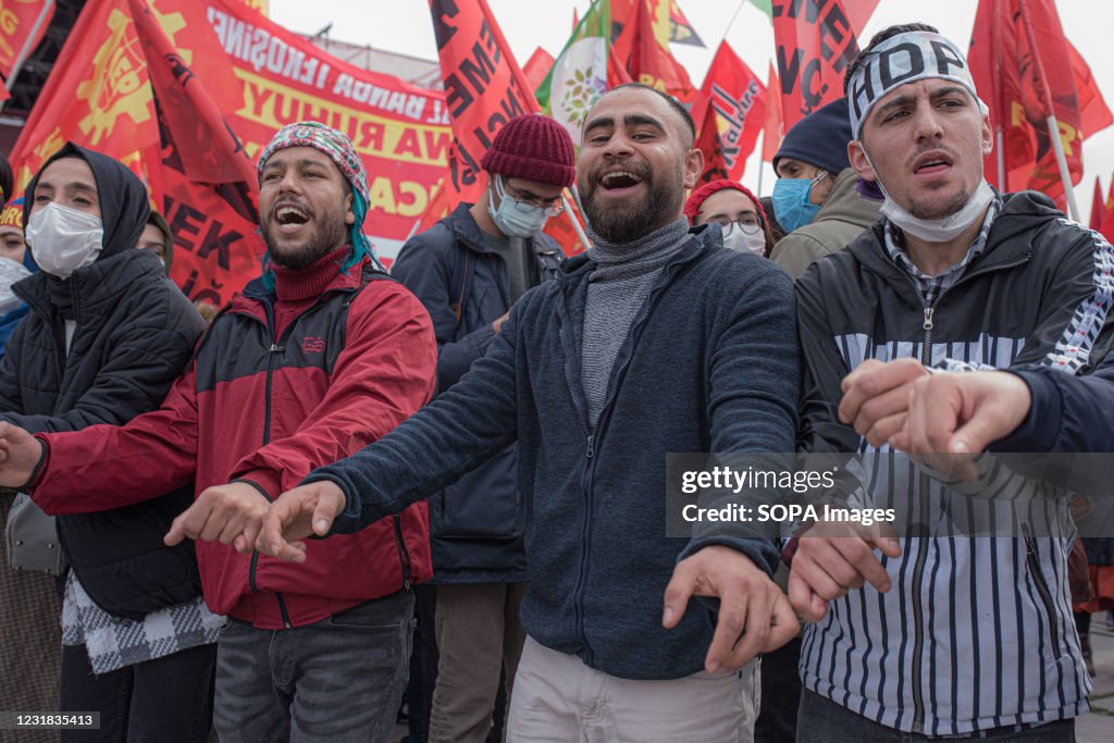 People are seen dancing during the Newroz festival in...