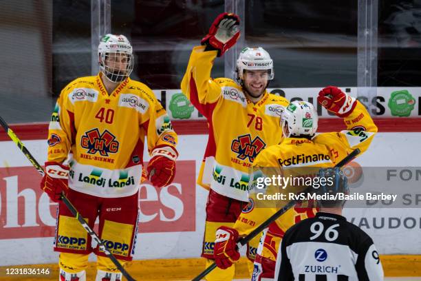 Marc-Antoine Pouliot celebrates his goal with Petteri Lindbohm and Damien Brunner of EHC Biel during the Swiss National League game between Lausanne...