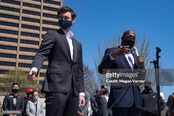 Sen. Jon Ossoff and Sen. Raphael Warnock speak to a group of demonstrators showing their support for Asian-American and Pacific Islander communities...