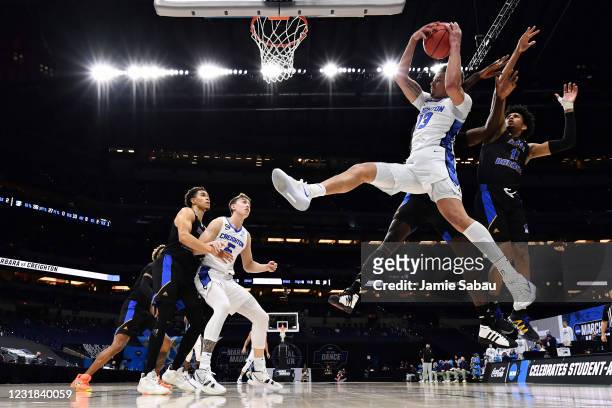 Christian Bishop of the Creighton Bluejays pulls down a rebound in the first half against the UC Santa Barbara Gauchos in the first round of the 2021...