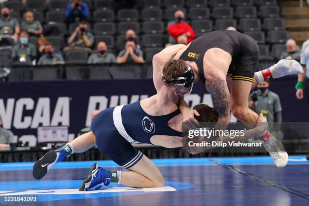 Nick Lee of Penn State wrestles Jaydin Eierman of Iowa in the 141lb weight class in the first-place match during the NCAA Division I Men's Wrestling...