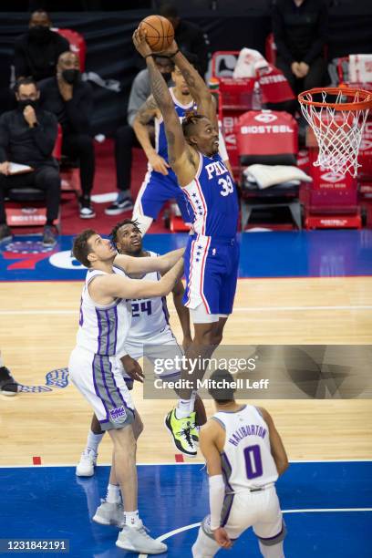 Dwight Howard of the Philadelphia 76ers goes up to dunk the ball but is fouled by Nemanja Bjelica of the Sacramento Kings in the third quarter at the...