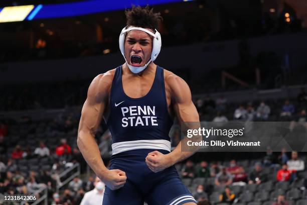 Cater Starocci of Penn State celebrates after beating Michael Kemerer of Iowa in the 174lb weight class in the first-place match during the NCAA...