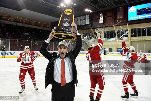 Head Coach Mark Johnson of the Wisconsin Badgers celebrates following the Badgers 2-1 win over the Northeastern Huskies in overtime during the...