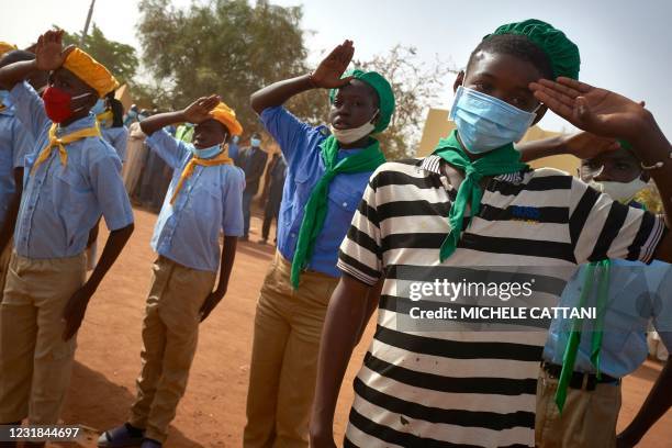 Children attend the opening ceremony of the new river port in Konna on March 20, 2021 as the Malian Prime Minister and his delegation visit the town...