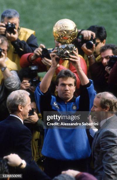 Lothar Matthäus of FC Internzaionale with his coach Giovanni Trapattoni , Hans Hubert Vogts celebrates in Milan after winning the golden ball during...