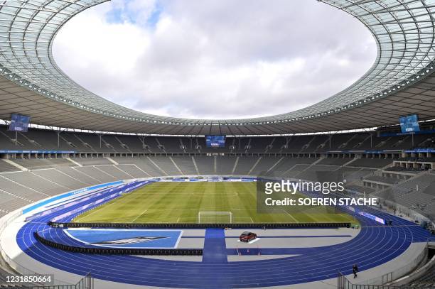 General view taken on March 21, 2021 shows the Olympic Stadium with empty stands prior to the German first division Bundesliga football match between...