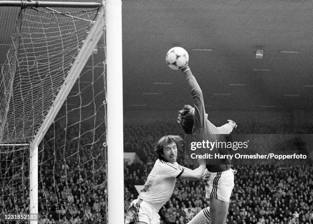 West Ham United goalkeeper Phil Parkes and teammate Billy Bonds attempt to clear the ball from under the crossbar during the Football League DIvision...