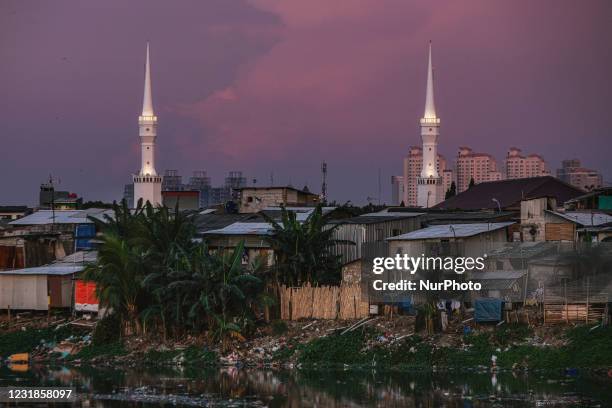 This picture shows a slum area during sunset in Jakarta on March 21, 2021. According to the Bank Indonesia Board of Governors, domestic economic of...
