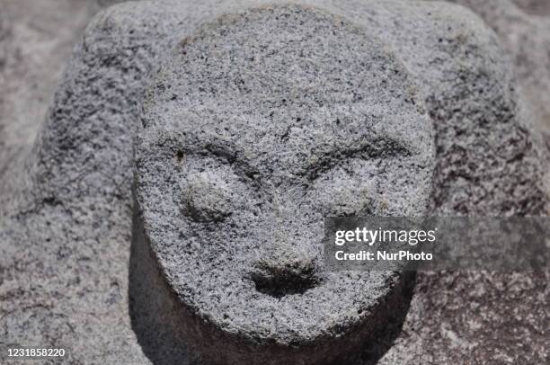 The megalithic carvings of Pokekea resembling human faces with statues are found in the Besoa Valley, Poso Regency, Central Sulawesi Province,...