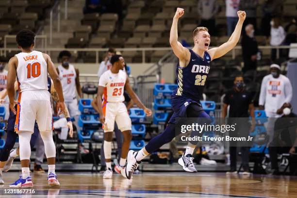 Francis Lacis of the Oral Roberts Golden Eagles celebrates the Eagles victory over the Florida Gators in the second round of the 2021 NCAA Division I...