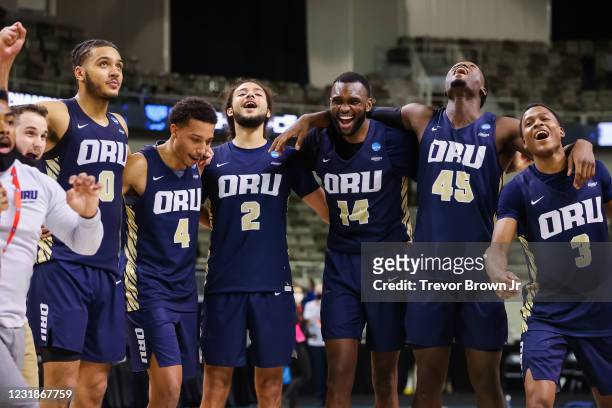 The Oral Roberts Golden Eagles celebrate their victory over the Florida Gators in the second round of the 2021 NCAA Division I Mens Basketball...